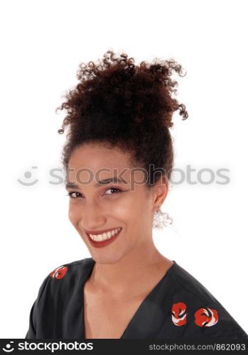 Close up image of a beautiful multi-racial woman in a black dress with some print and with her black hair in a bunof her head, isolated for white background