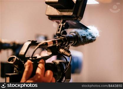 Close-up Image of a camera at a night press conference  