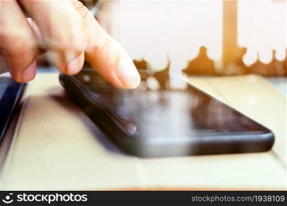 Close up image of a man using mobile smart phone