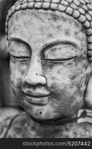 Close up image of buddha statue in stone