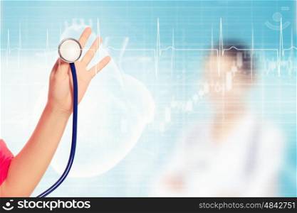 Close-up image of doctor's hand holding stethoscope