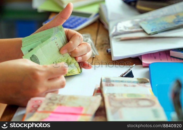 close up image of female hand count the money, business accounting background