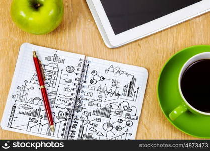 Close up image of tablet pc apple cup of coffee on table. Office workplace