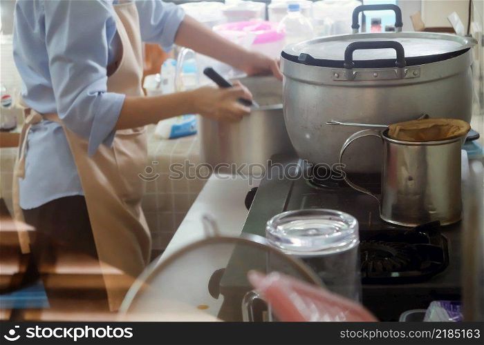 Close up Image of Woman preparing food at the stove