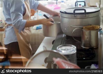 Close up Image of Woman preparing food at the stove