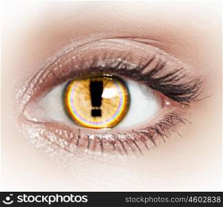 Close-up image of woman's eye with symbol