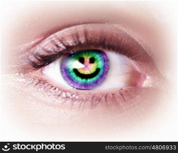 Close-up image of woman's eye with symbol