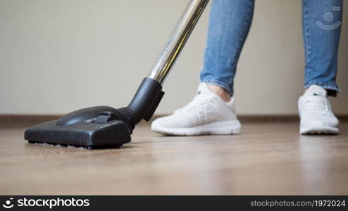 close up individual using vacuum cleaner. High resolution photo. close up individual using vacuum cleaner. High quality photo