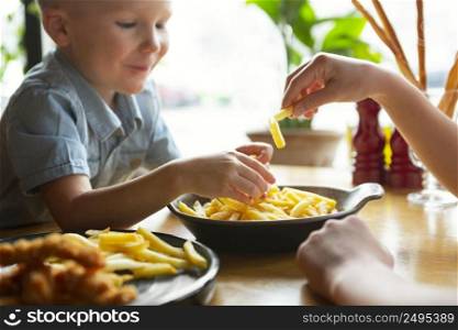 close up kid eating french fries