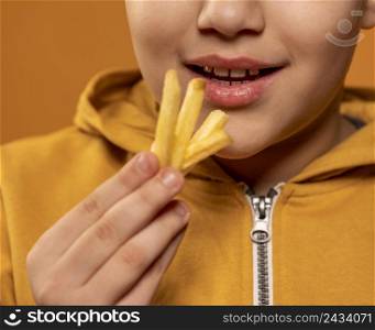 close up kid eating fries