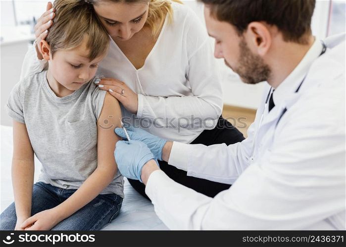 close up kid getting vaccinated