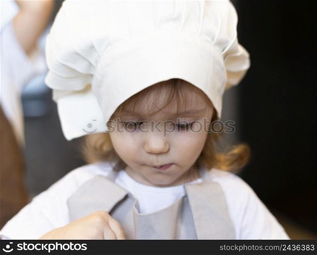 close up kid wearing cook clothes