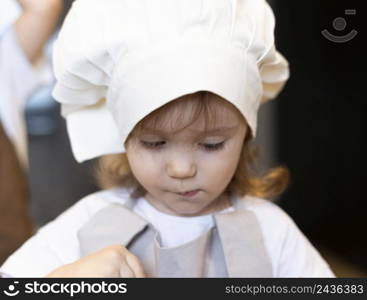 close up kid wearing cook clothes