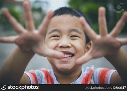 close up laughing face of asian children playing with happiness emotion