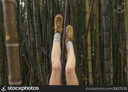 close up legs posing with bamboo