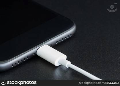 close-up lightning cable connect to phone