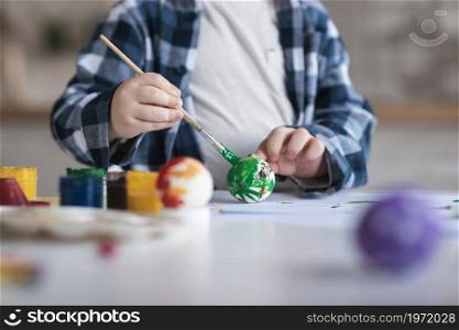 close up little boy painting eggs easter. High resolution photo. close up little boy painting eggs easter. High quality photo