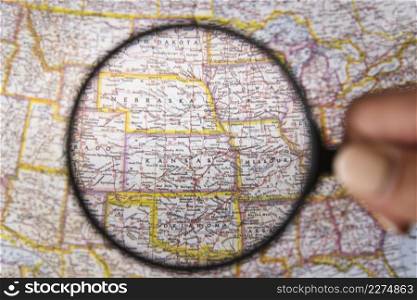 close up magnifying glass showing places map