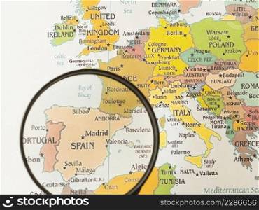 close up magnifying glass showing spain 
