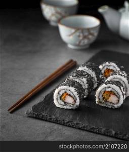 close up maki sushi rolls with black sesame seeds