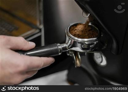 close up male barista using professional coffee machine. Beautiful photo. close up male barista using professional coffee machine