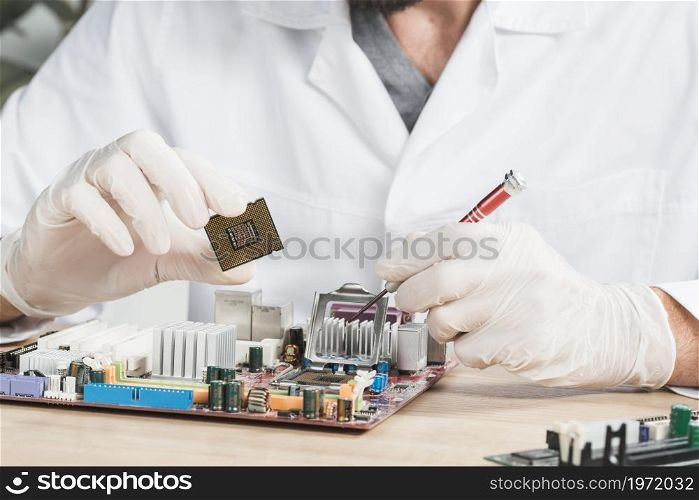 close up male technician holding computer chip. High resolution photo. close up male technician holding computer chip. High quality photo