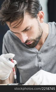 close up male technician repairing broken mobile phone