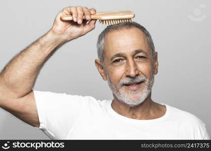 close up man brushing his hair