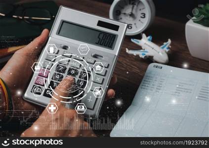 Close up man calculate expense monthly with banking life insurance home loan travelling credit card annual savings money heath care costs growth up chart. Financial and spending payment concept.