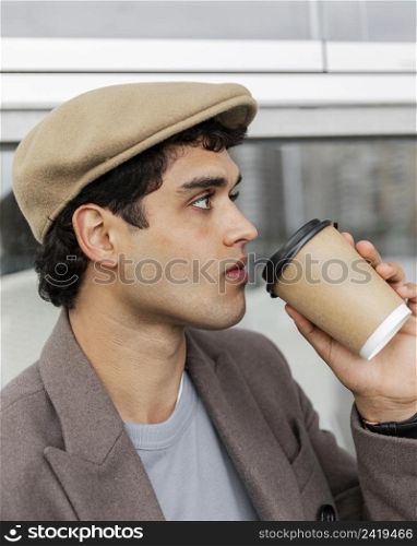 close up man drinking coffee