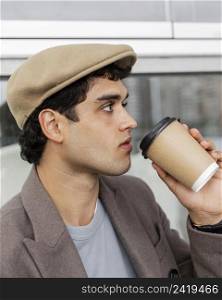 close up man drinking coffee