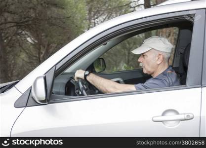 Close-up man driving a car