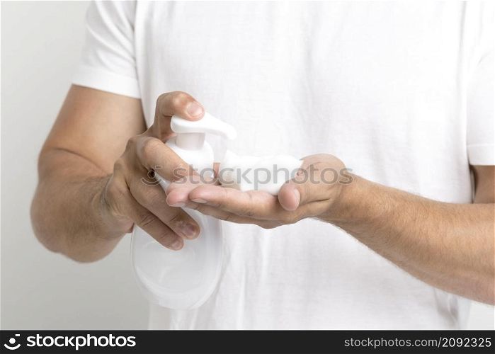 close up man hand spraying shaving foam