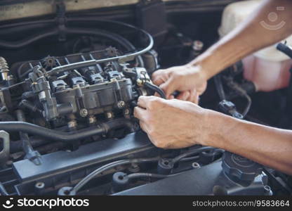 Close up Man hands fixing Car machinery vehicle mechanical service. Mechanic man hands repairing car auto repair shop. open vehicle hood checking up auto mobile. Vehicle Car maintenance engineer.