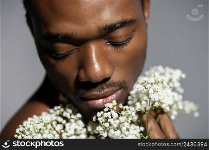 close up man holding beautiful flowers
