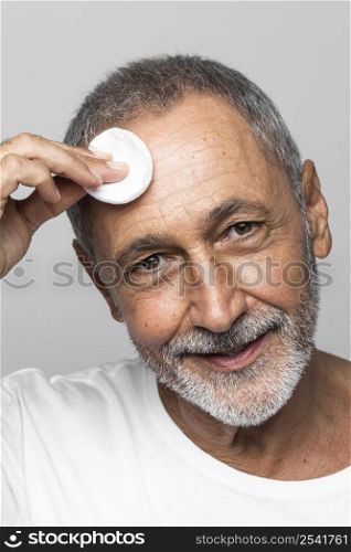 close up man holding cotton pad
