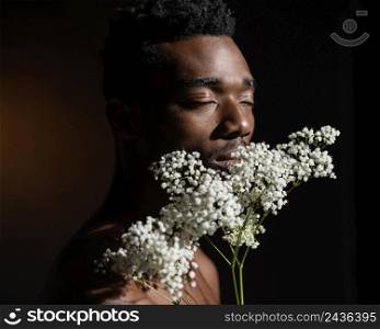 close up man holding flowers