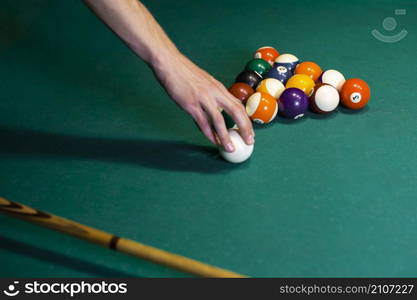 close up man holding white ball