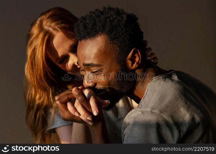 close up man kissing woman s hand