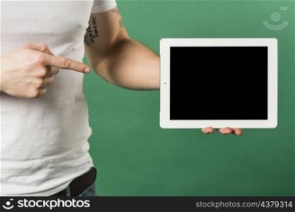 close up man s finger pointing finger toward digital tablet with black screen display