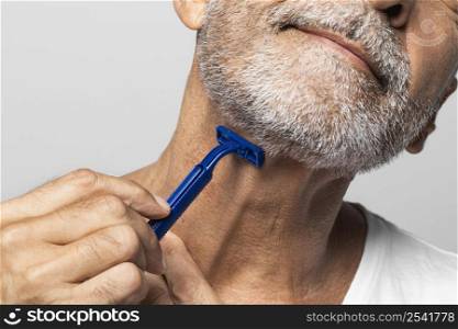 close up man shaving his neck 3