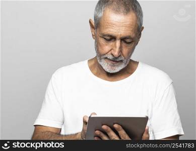 close up man using tablet