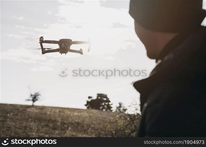 close up man watching drone. Beautiful photo. close up man watching drone