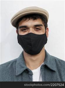 close up man wearing face mask