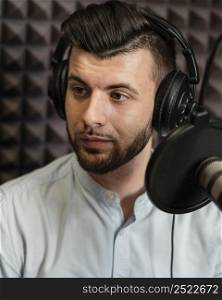 close up man wearing headphones