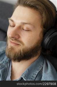 close up man with headphones home