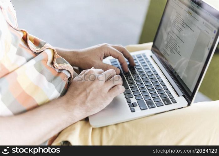 close up man working with laptop