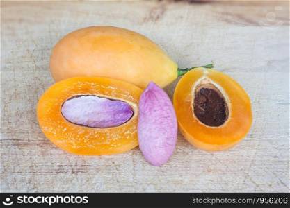 Close up marian plum on wooden background