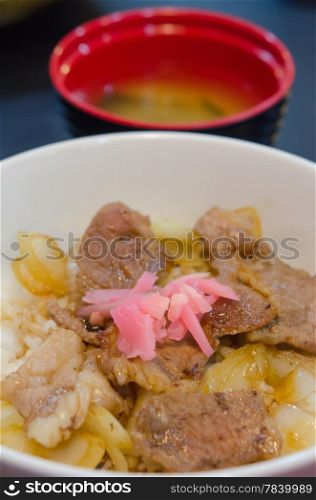 close up meat over rice , Japanese style food