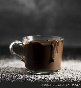 close up melted chocolate transparent cup